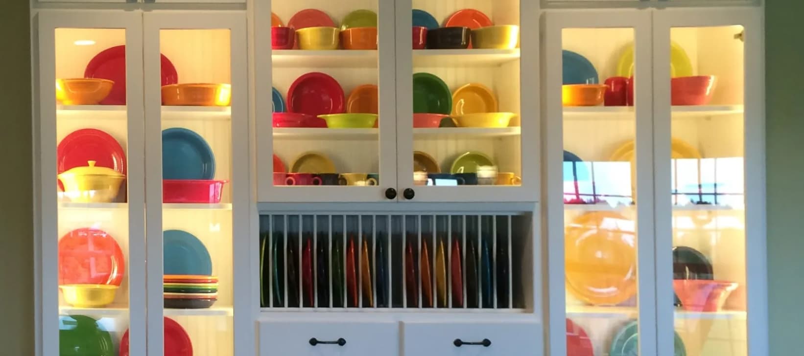 A large hutch with colorful dishes